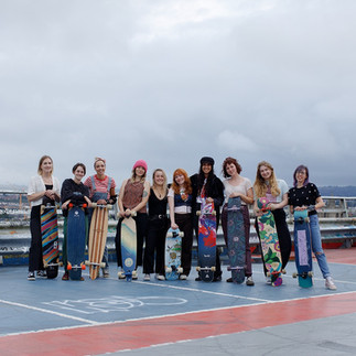 Skater girls standing for a picture on a multi storey car park