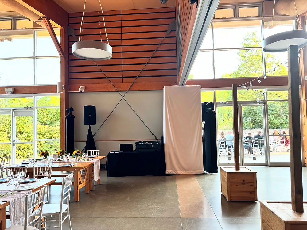 DJ setup in a modern event hall ready for a celebration