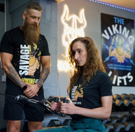 Personal trainer ashford kent guiding client through safe training session in private gym