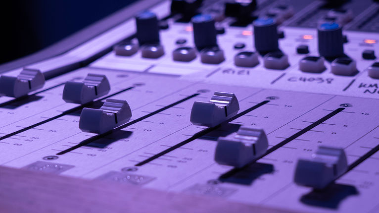 Close up of mixing desk faders