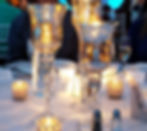 Gold Mercury Glass Pedestal candle holders with gold crystal votives at a Peoria Wedding Venue.