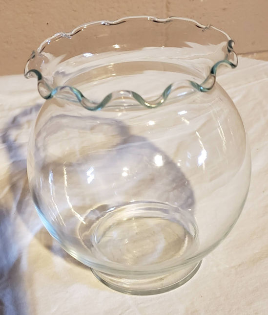 Fluted clear glass vase.
