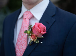 Boutonniere for a groom made out of pink roses