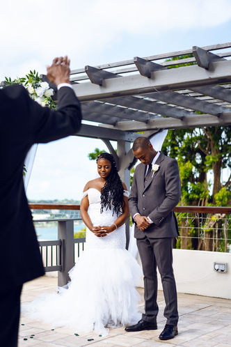 couple wearing traditional wedding attire in Saint Lucia hotel