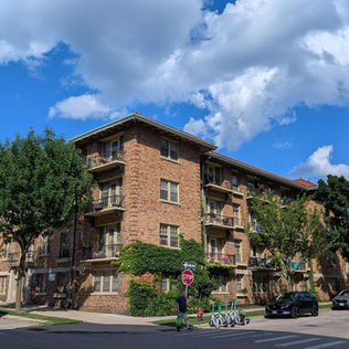 Apartment Complex on Milwaukee's Upper East Side with Lime Scooters and Pedestrian Traffic