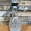 Thumbnail: Vintage rounded glass decanter with metal neck band