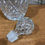 Thumbnail: Vintage rounded glass decanter with metal neck band