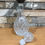 Thumbnail: Vintage rounded glass decanter with metal neck band