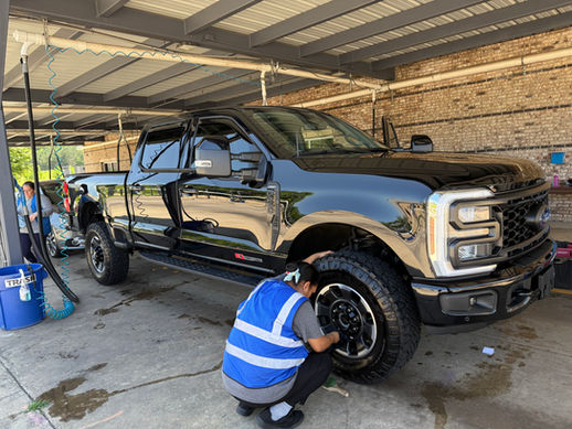 image of two women detailling a 4x4 truck