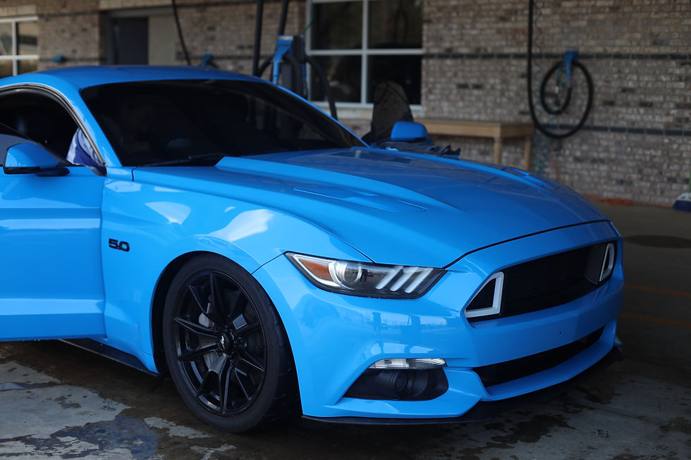 A blue mustang at a car detail shop