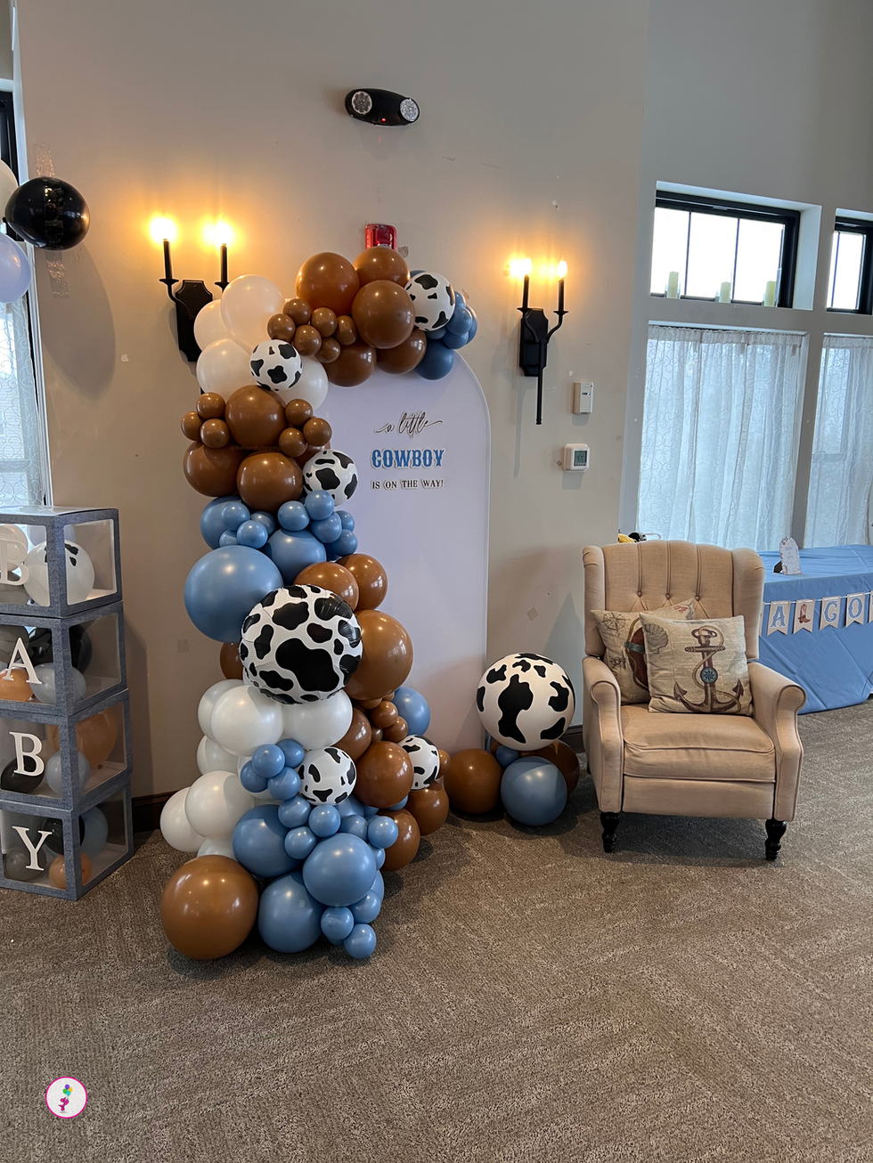 Little cowboy balloon garland with chiara backdrop and seating area in blue brown white with cow print balloons