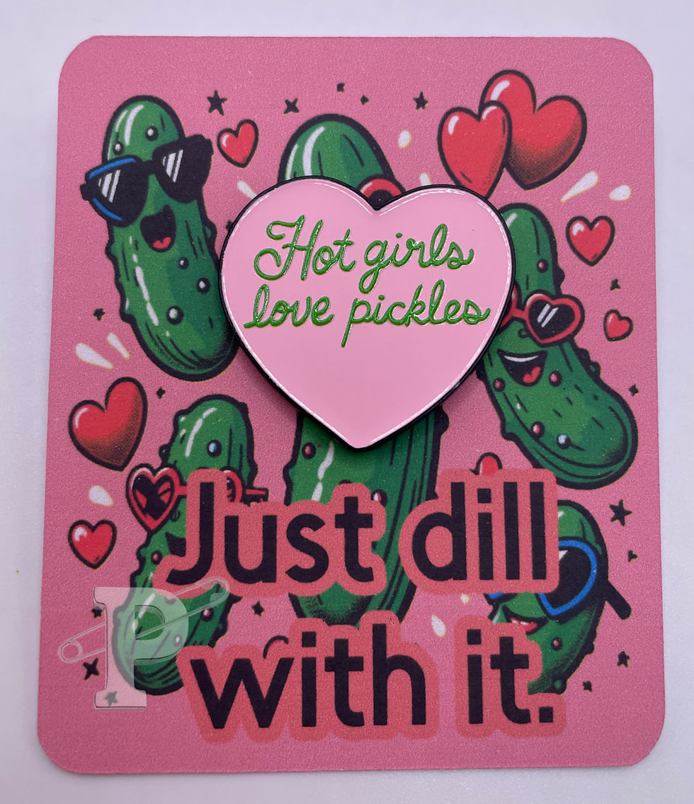 Flat card with pink heart enamel pin that says “Hot girls love pickles” on a background of cartoon pickles and hearts.