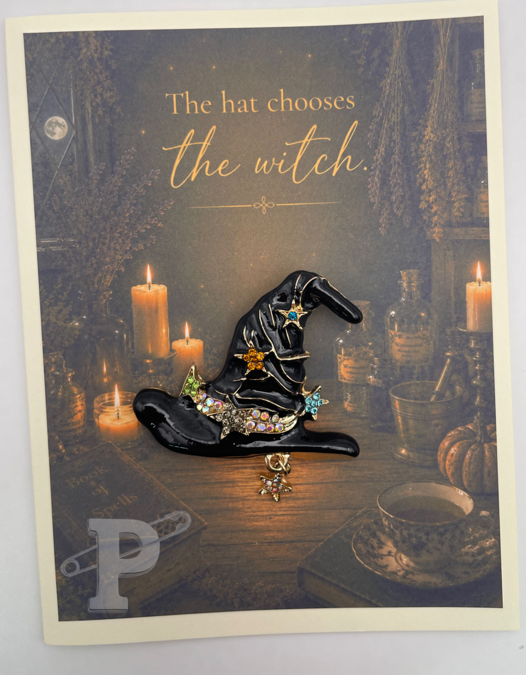 Gift-boxed witch hat brooch greeting card featuring the sentiment: "The hat chooses the witch."