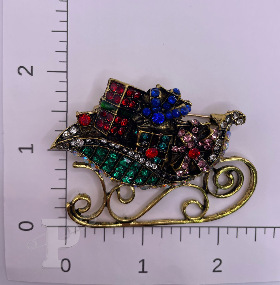 Thumbnail: Jeweled Christmas sleigh brooch shown with ruler for size reference