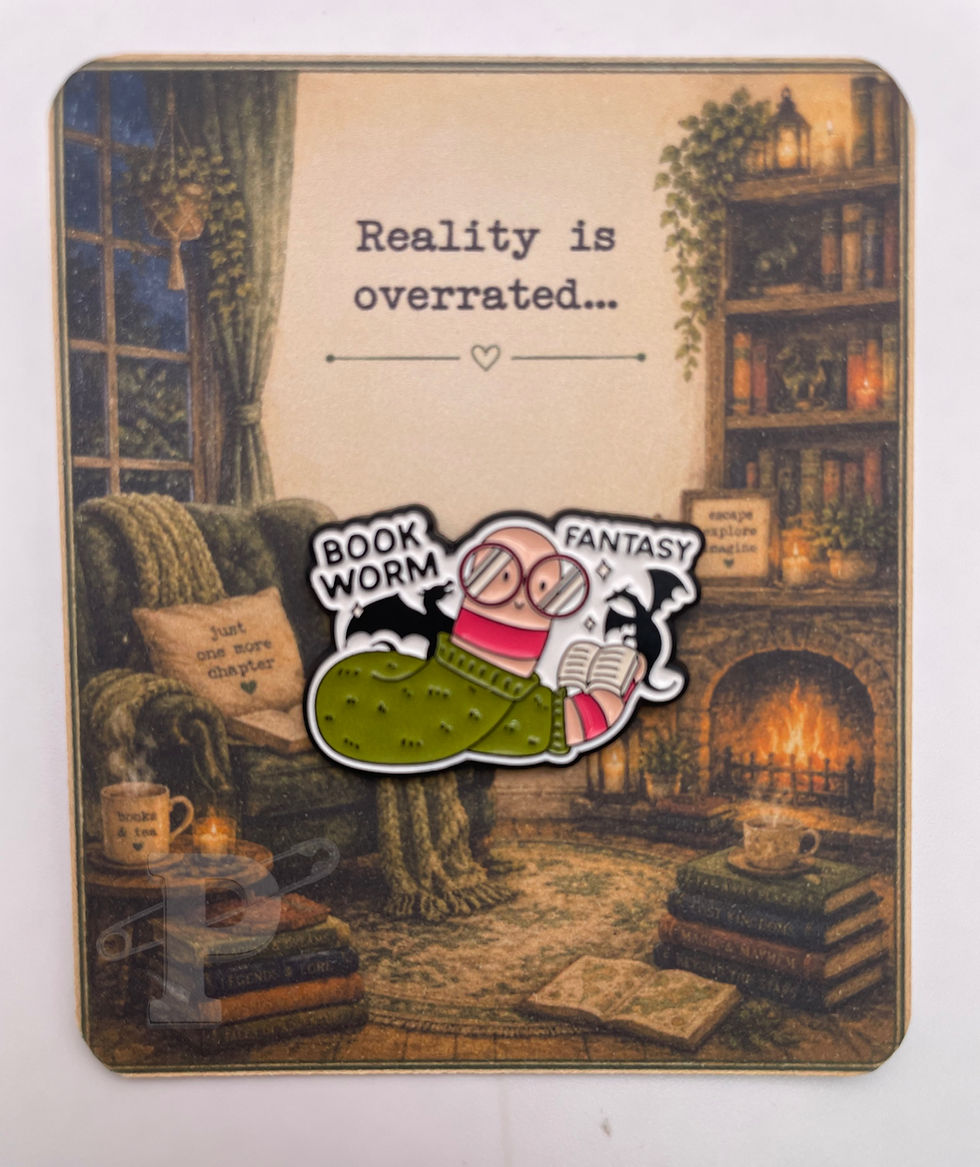 Bookworm Fantasy enamel pin on a cozy library pin card with the sentiment "Reality is overrated."