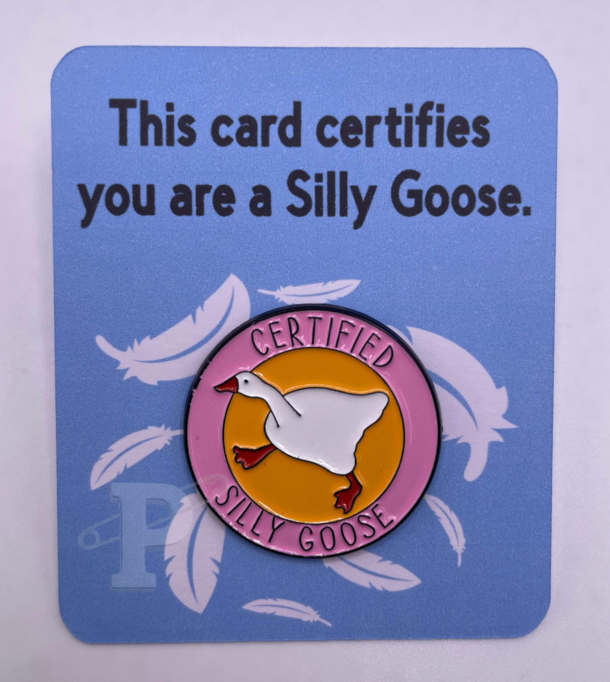 Flat card that reads “This card certifies you are a Silly Goose” with a certified silly goose pin.