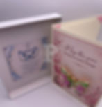Open gift box displaying a handmade card with removable floral butterfly brooch and coordinating Butterfly Symbol Meaning kee