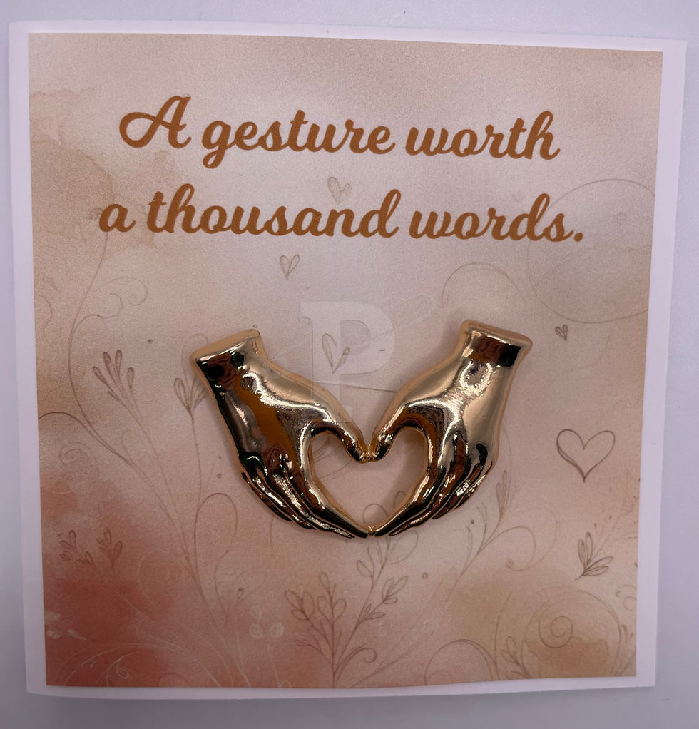 Thumbnail: A mini card that says "A gesture worth a thousand words" with brooch shaped like a hand-held heart attached.