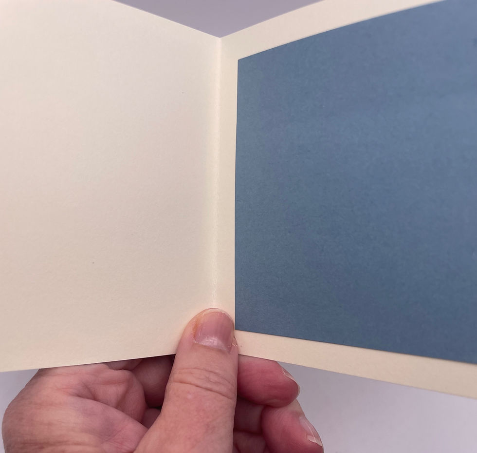 Blank cream-colored interior of the mini greeting card with a coordinating blue writing panel.