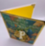 Top view of a greeting card that reads "I ain't lion, you're paws-itivley amazing with a lion brooch attached