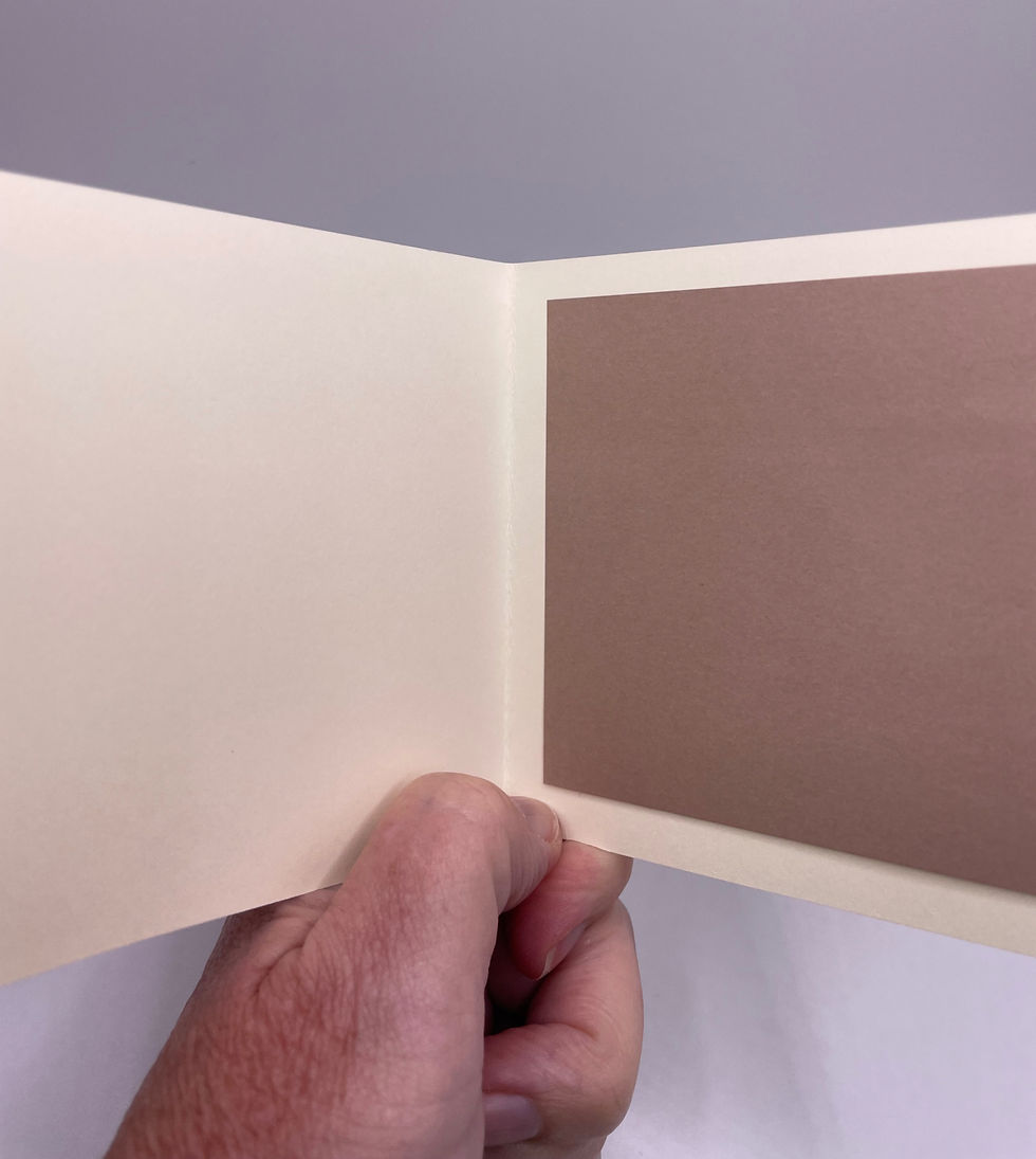 Blank cream-colored interior with a mauve color-coordinated writing panel.