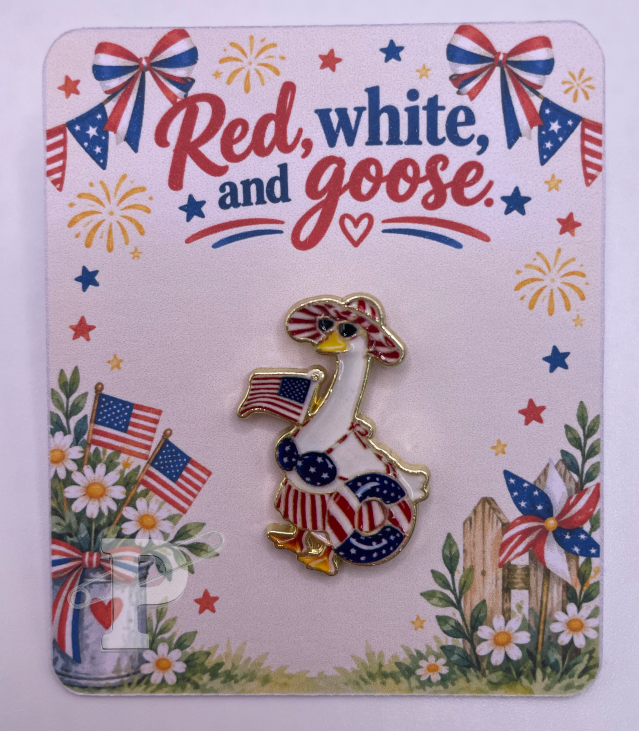 Patriotic goose enamel pin on red white and goose card.