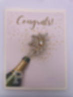 Champagne celebration brooch congratulations card with sparkling Congrats sentiment