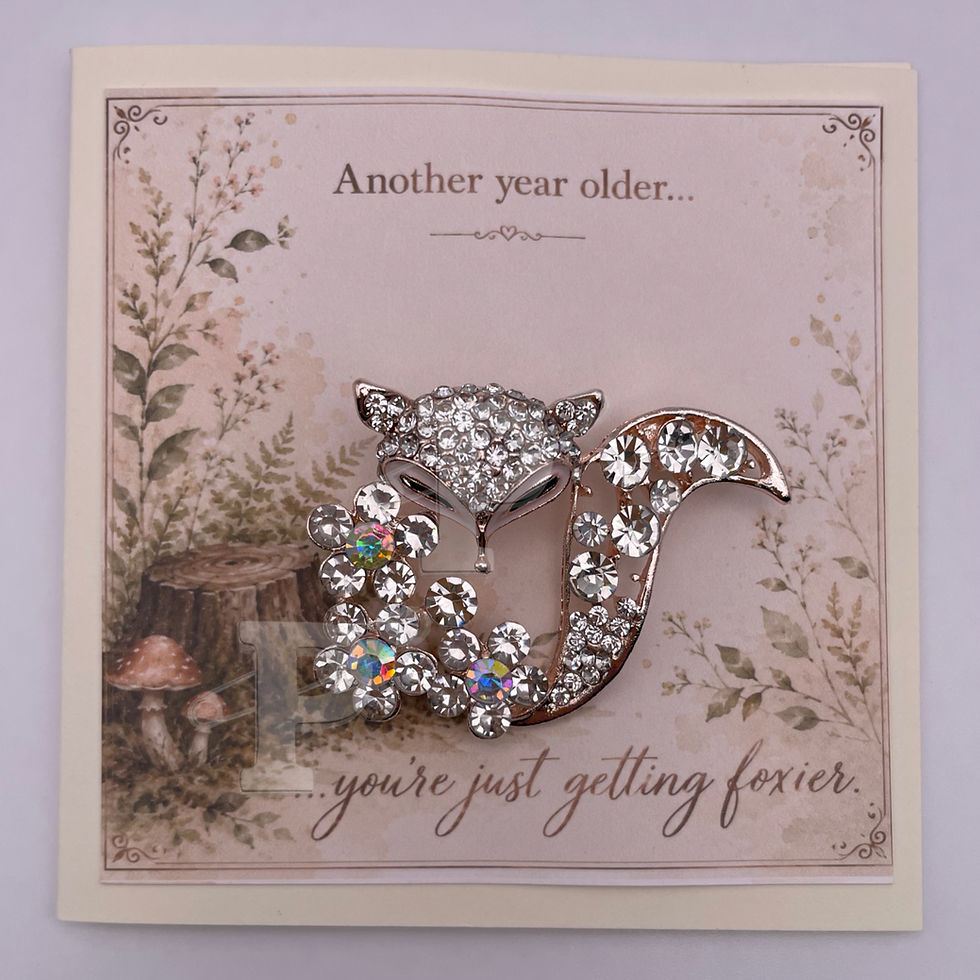 Greeting card with removable crystal fox brooch and the sentiment, "Another year older...you're just getting foxier."