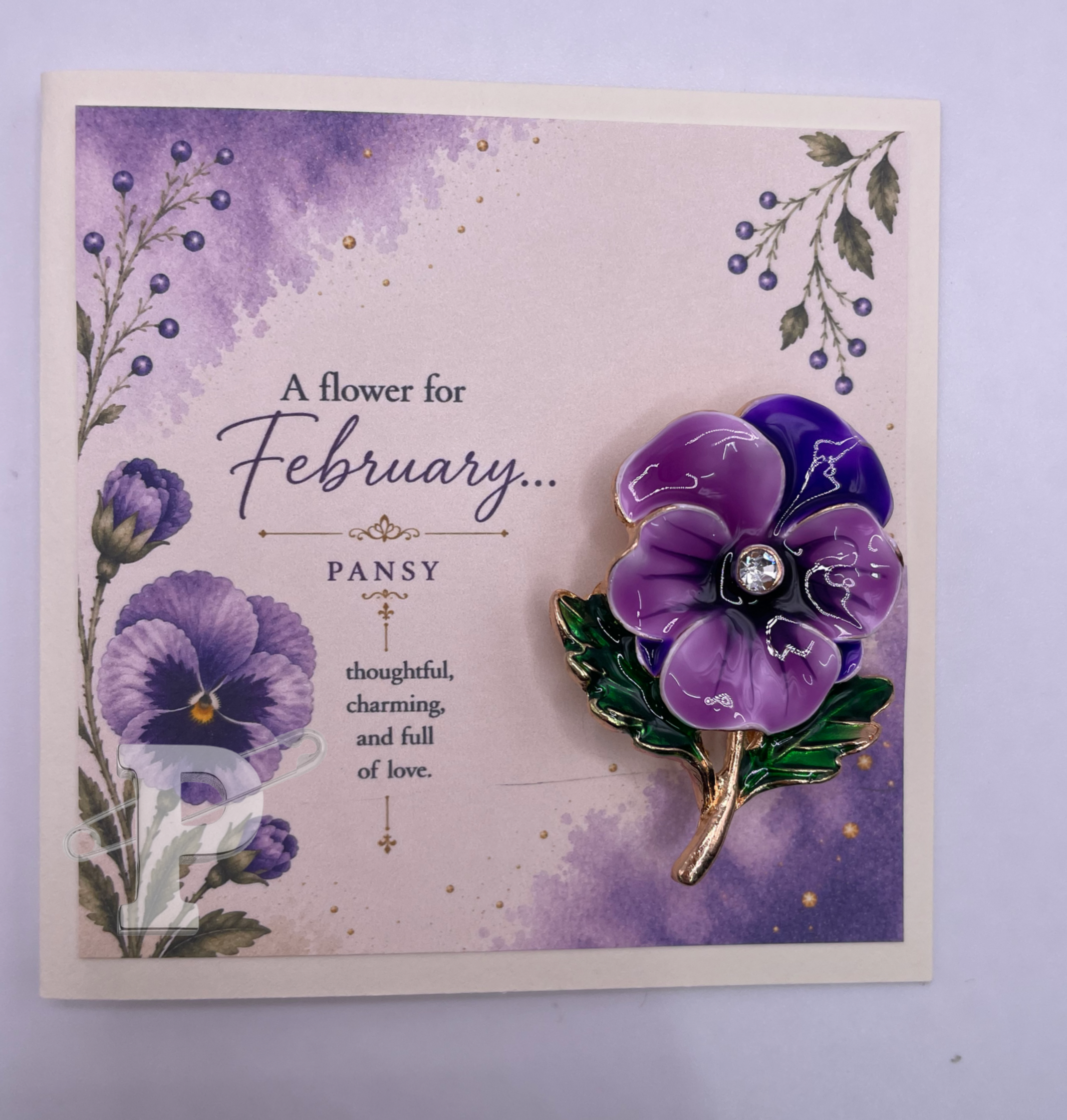 February birth month flower card featuring a purple pansy brooch and watercolor pansy artwork.