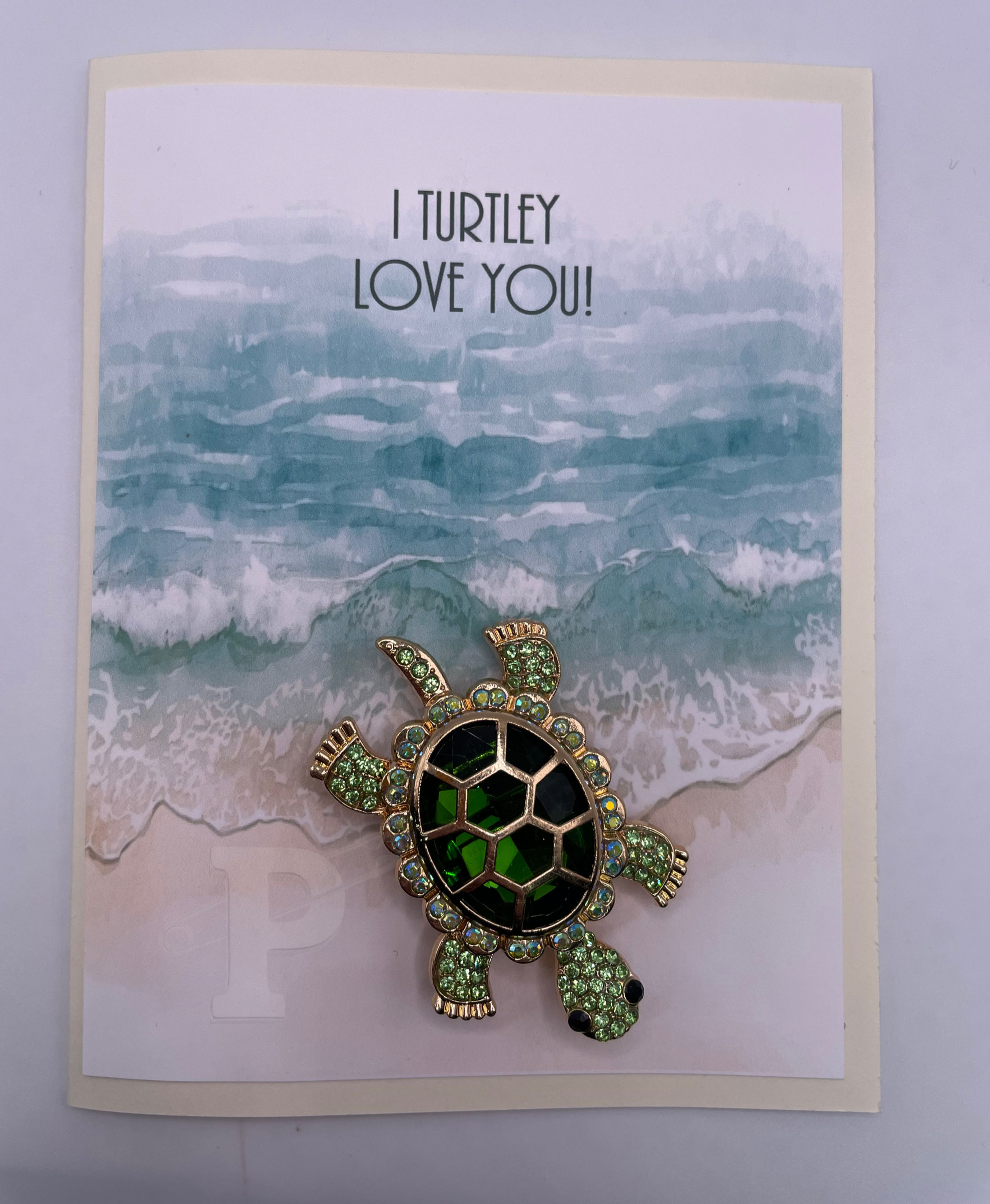 Greeting card with jeweled green turtle brooch that reads, “I Turtley Love You!”