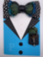Greeting card shaped like a suit jacket with peacock blue background, polka dot feather bow tie, and matching lapel pin