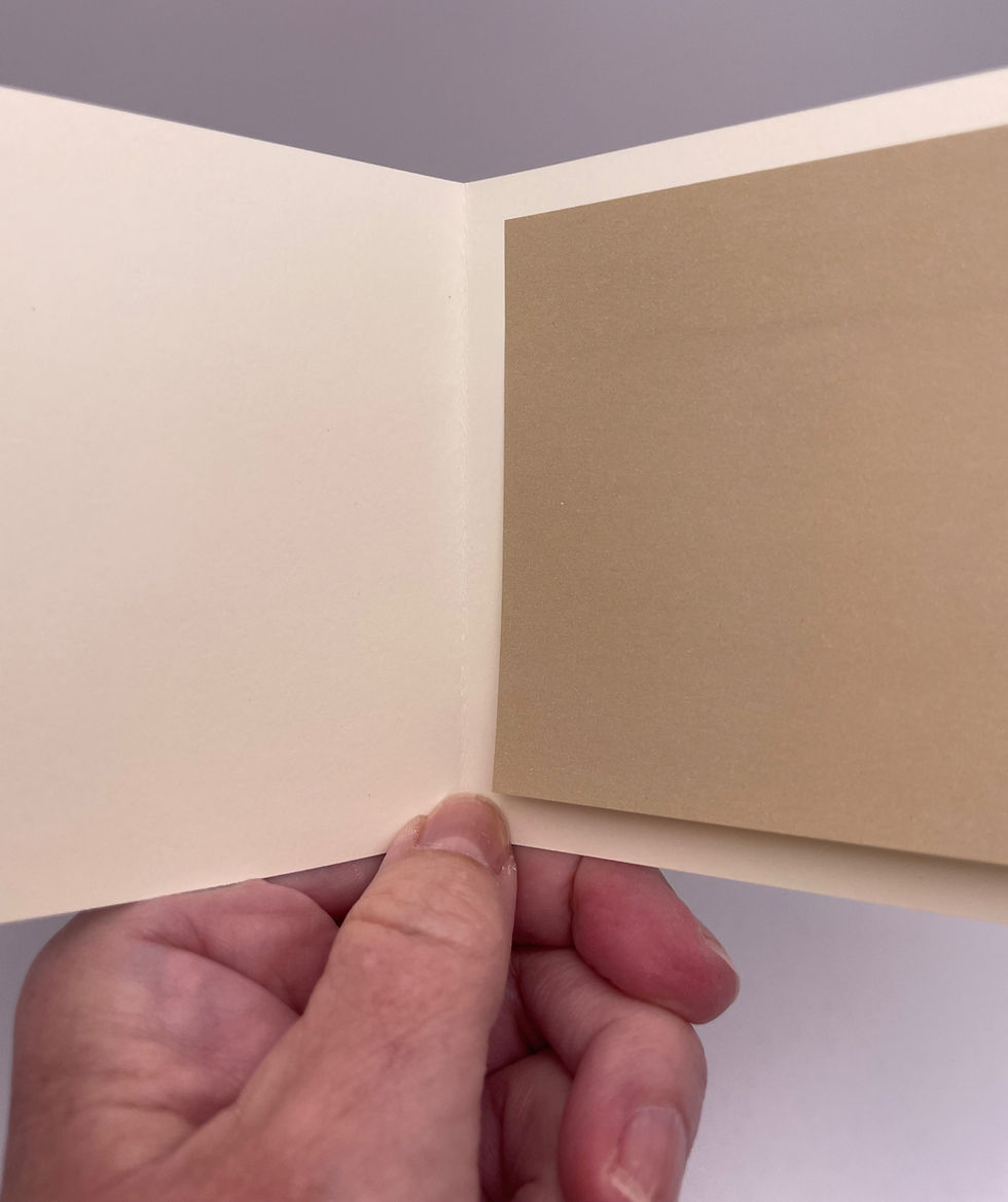 Blank cream-colored interior of the mini greeting card with a coordinating warm taupe writing panel.