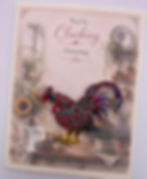 Gift-boxed farmhouse greeting card featuring a jeweled rooster brooch with the sentiment: "You're Clucking Amazing."