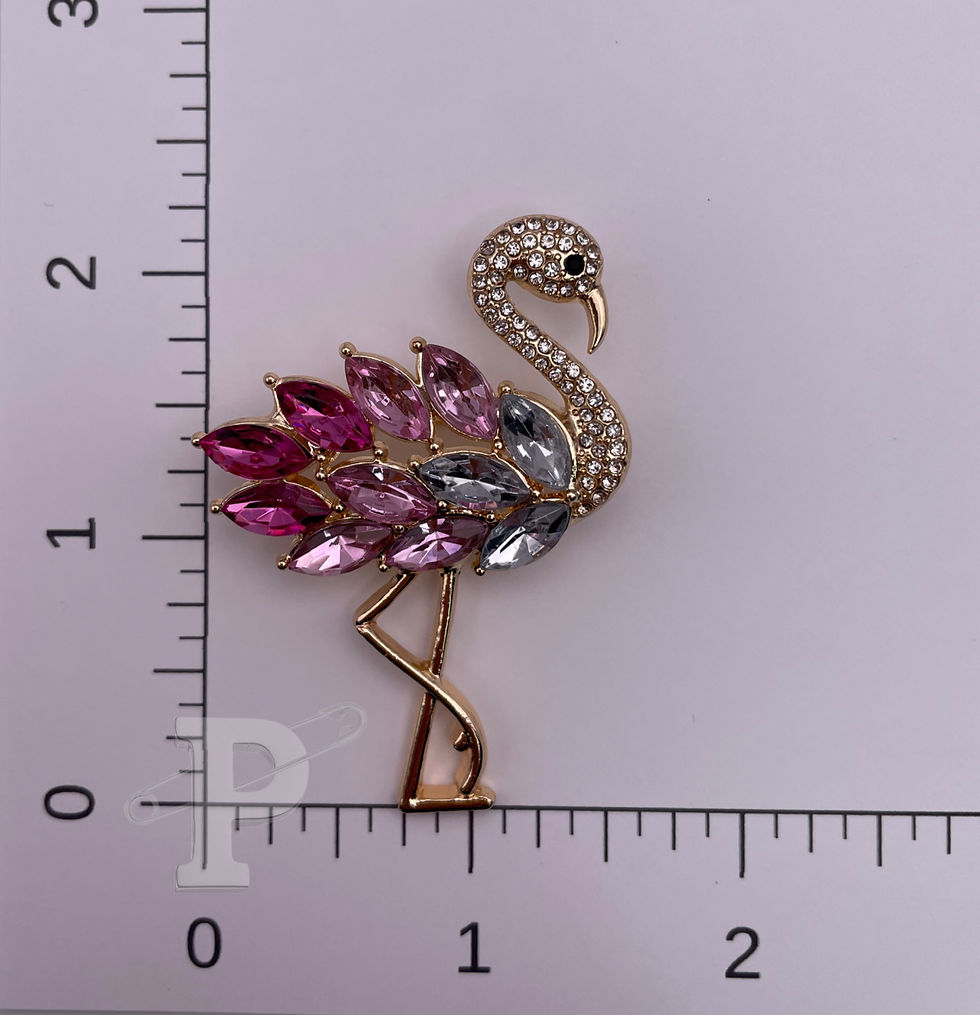 Thumbnail: Pink crystal flamingo brooch shown with ruler for size reference.