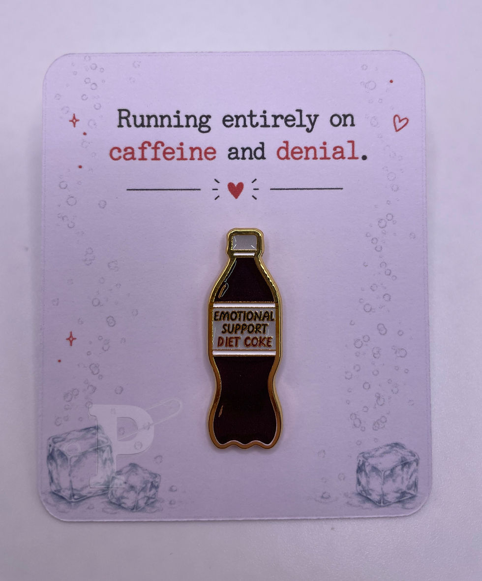 Emotional Support Diet Coke bottle enamel pin displayed on a card with sentiment “Running entirely on caffeine and denial"