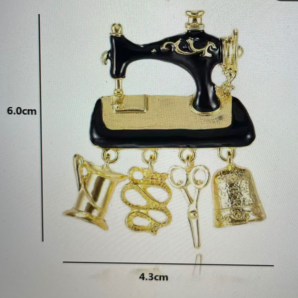Thumbnail: Black and gold sewing machine brooch with dangling accessories