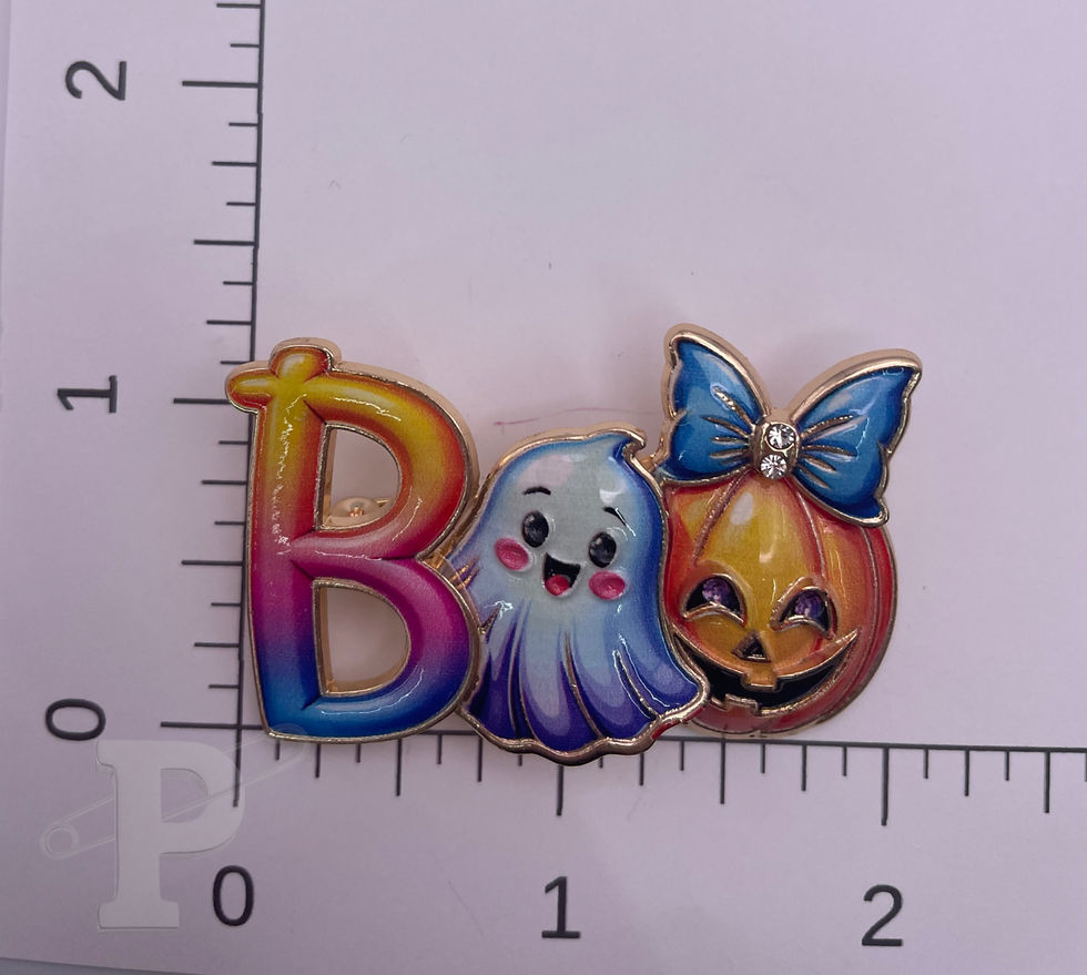 Thumbnail: Colorful BOO ghost and pumpkin enamel brooch shown beside a ruler for size reference.