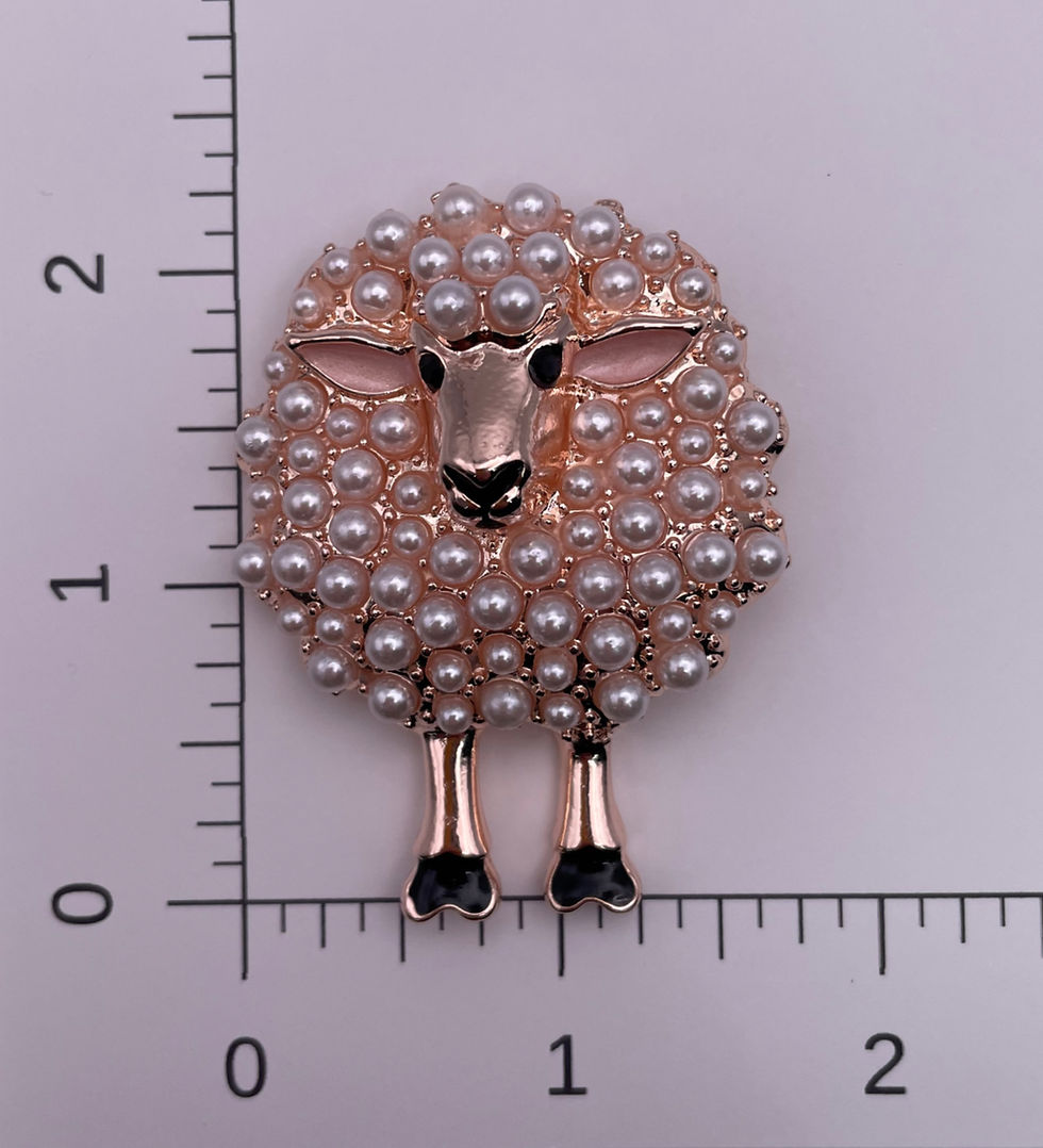Thumbnail: Pearl sheep brooch shown beside a ruler for size reference.