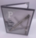 Top view of card with bookmark that reads, “Enjoy the next chapter,” with sentiment “The best chapters are still unwritten"