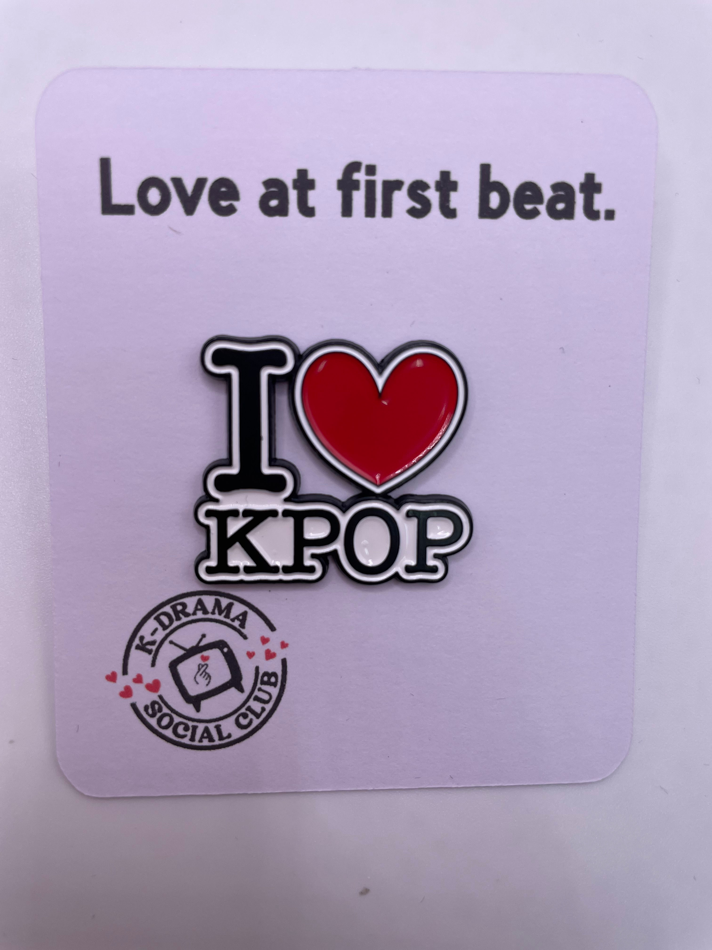 Flat card that reads "Love at first beat" with pin "I love K-pop"