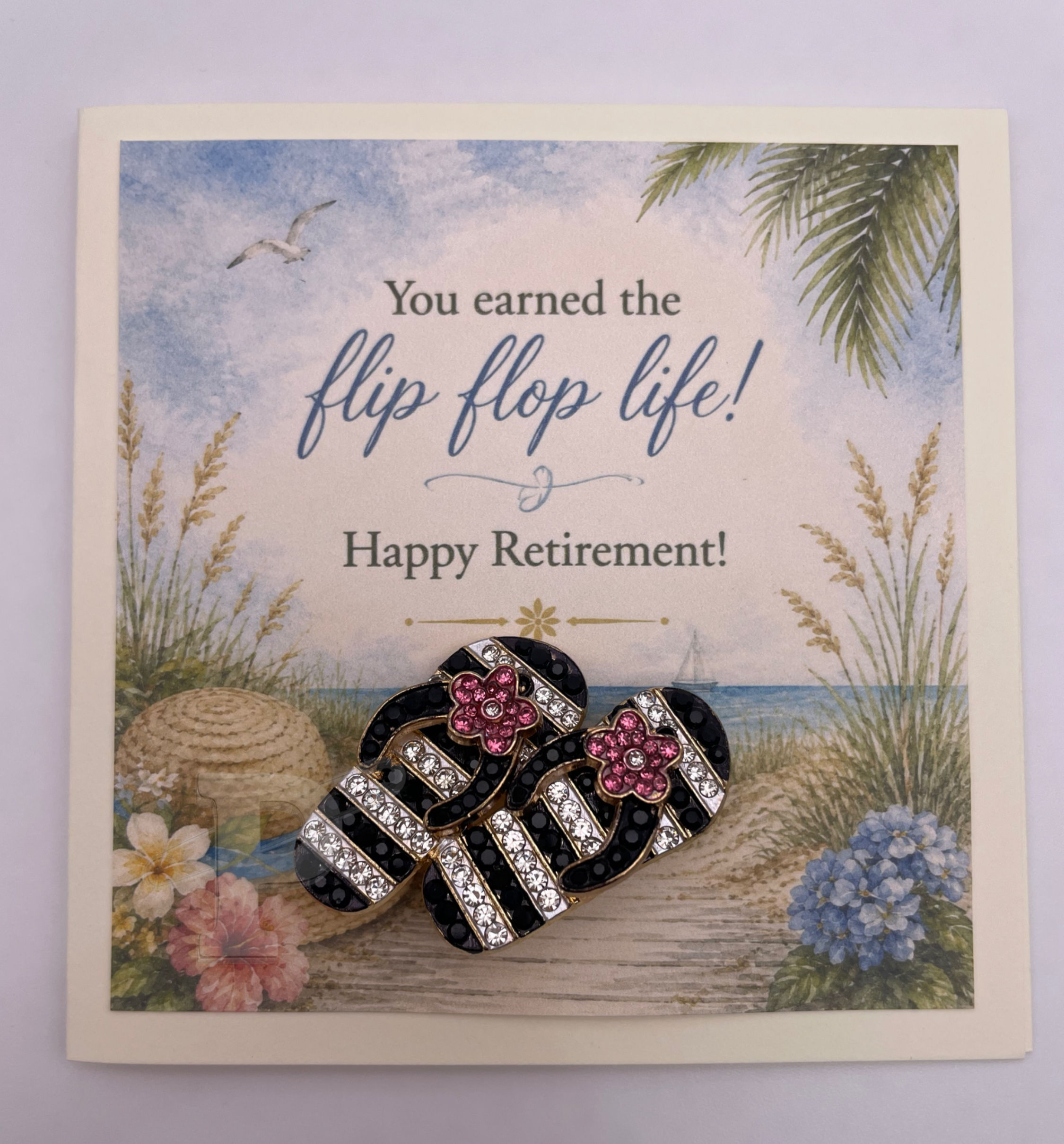Mini retirement greeting card featuring a pink striped flip-flops brooch with the sentiment, "You earned the flip flop life!