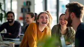 CHW-happy-coworkers-sharing-laugh-modern-office-space.jpg