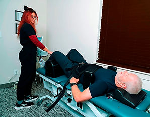 Spinal Decompression tech and man on Spinal Decompression