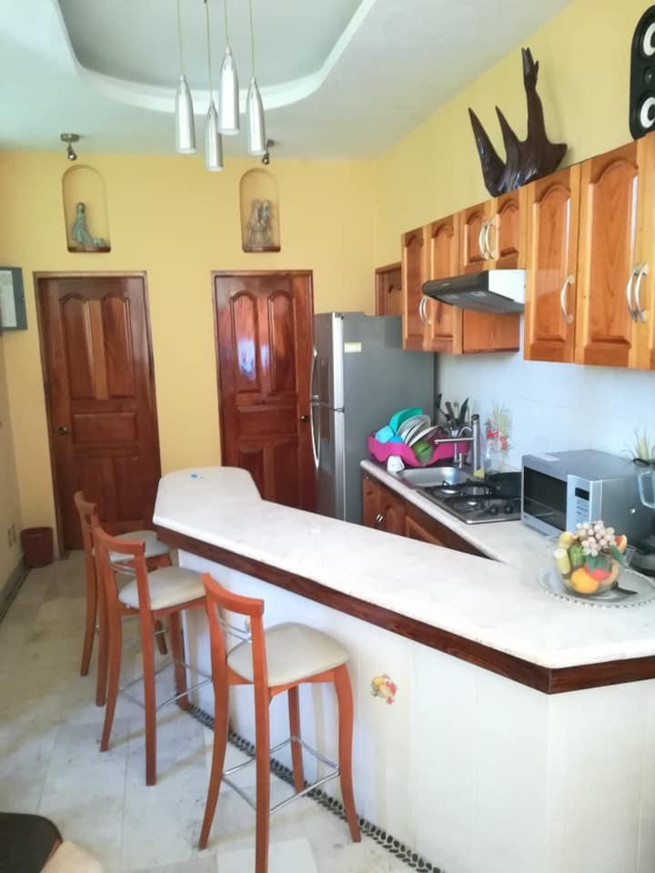 HERMOSA RESIDENCIA ESTILO RÚSTICO-CONTEMPORÁNEO CON LUJOSOS ACABADOS; EXCELENTE PARA DISFRUTARLA CON TU FAMILIA; UBICADA EN EL CENTRO DE ZIHUATANEJO A 5 MINUTOS DE LOS PRINCIPALES CENTROS DE COMERCIO, ZONA BANCARIA Y PLAYAS.
PRIMER PLANTA:
CASA PRINCIPAL CONSTA DE: SALA, COMEDOR, COCINA EQUIPADA, JARDÍN INTERIOR CON VITRALES, 2 BAÑOS, 3 RECÁMARAS TODAS CON AIRE ACONDICIONADO, CLOSETS DE MADERA DE CEDRO.
• RECAMARA PRINCIPAL CON BAÑO, VESTÍBULO Y JACUZZI, CON ACCESO DIRECTO A LA ALBERCA Y SALA DE ESTAR.
• SEGUNDA RECAMARA Y TERCER RECAMARA COMPARTEN BAÑO, TODOS LOS BAÑOS CON CANCELARÍA DE CRISTAL TEMPLADO, ESTUDIO, 1/2 BAÑO DE VISITA, PISOS DE MÁRMOL. GARAJE PARA 2 AUTOS, CISTERNA CON CAPACIDAD DE 25,000 LTS.
• ALBERCA CON BAÑO, VESTIDOR Y CUARTO DE BOMBAS DE FILTRADO,
• CUARTO DE SERVICIO CON ESPACIO PARA LAVADORA Y SECADORA
• CISTERNA CON CAPACIDAD DE 10,000 LTS.
• CÁMARAS DE CIRCUITO CERRADO PARA VÍDEO VIGILANCIA, PERÍMETRO PROTEGIDO, BARDEADO, ENREJADO Y CIRCULADO CON CONCERTINA TIPO BISTURÍ
• PORTÓN DE ACCESO Y PUERTA DE PLACA DE ACERO TIPO BLINDAJE CON APERTURA DE PORTÓN AUTOMATIZADO Y PUERTA CON VIDEO PORTERO Y APERTURA AUTOMÁTICA.
• LOCAL COMERCIAL CON ACCESO DE LA CALLE, EQUIPADO PARA OFICINA CON DIVISIONES DE CRISTAL TEMPLADO E ILUMINACIÓN EN LEDS, AIRE ACONDICIONADO TIPO MINI SPLIT, BAÑO Y ACCESO DE PUERTA DE CRISTAL TEMPLADO AUTOMATIZADO,PISOS DE MÁRMOL CON PARED DE MADERA DE PAROTA.
• SEGUNDA PLANTA: UN DEPARTAMENTO TIPO BUNGALOW, TOTALMENTE CON ENTRADA INDEPENDIENTE CON ACABADOS EN MÁRMOL Y MADERAS PRECIOSAS E ILUMINACIÓN DE LEDS. 2 RECAMARAS CON AIRE ACONDICIONADO TIPO MINI SPLIT Y PANTALLAS LCD CON CABLE; UNA CON CAMA KING SIZE Y LA OTRA CON 2 CAMAS INDIVIDUALES, TODAS CON CLOSETS DE MADERA DE CEDRO. COCINA CON BARRA. SALA DE ESTAR CON SISTEMA DE SONIDO, LUCES LED´S DE AMBIENTACIÓN. JARDÍN CON ESPACIOSA CABAÑA CONSTRUIDA CON MADERAS PRECIOSAS CON ESPACIO PARA 4 HAMACAS.
●CONSTA DE 319.08 MTS 2. DE TERRENO
●CONSTA DE 301.84 MTS 2 DE CONSTRUCCIÓN.
● INCLUYE MOBILIARIO EXCEPTO EL ARTE.
____________________
BEAUTIFUL CONTEMPORARY-RUSTIC STYLE RESIDENCE WITH LUXURY FINISHES; EXCELLENT TO ENJOY WITH YOUR FAMILY; LOCATED IN TOWN OF ZIHUATANEJO, GUERRERO MÉXICO, 5 MINUTES FROM THE MAIN CENTERS OF COMMERCE, BANK AREA AND BEACHES.
FIRST FLOOR:
MAIN HOUSE CONSISTS: LIVING ROOM, DINING ROOM, EQUIPPED KITCHEN, INTERIOR GARDEN WITH VITRALS, 2 BATHROOMS, 3 BEDROOMS ALL WITH AIR CONDITIONING, CEDRO WOOD CLOSETS.
MAIN BEDROOM WITH BATH, DRESSING ROOM AND JACUZZI, WITH DIRECT ACCESS TO THE POOL AND LIVING ROOM.
SECOND BEDROOM AND THIRD BEDROOM SHARE BATHROOM, ALL BATHROOMS WITH TEMPERED GLASS CANCELLATION, STUDY, 1/2 VISIT BATH, MARBLE FLOORS. GARAGE FOR 2 CARS, 1 TANK WITH CAPACITY OF 25,000 LTS
POOL WITH BATHROOM, DRESSING ROOM AND FILTER PUMPS
SERVICE ROOM WITH SPACE FOR WASHING AND DRYER AND TANK WITH CAPACITY OF 10,000 LTS.
CLOSED CIRCUIT CAMERAS FOR VIDEO SURVEILLANCE, PROTECTED PERIMETER, BARRIED AND CRIEDED CIRCULATE WITH SCALPEL TYPE CONCERTINE, ACCESS GATE AND STEEL PLATE DOOR ARMOR TYPE WITH AUTOMATIC AUTOMATED AND DOOR OPENED DOOR OPENING.
COMMERCIAL PREMISES WITH STREET ACCESS, EQUIPPED FOR OFFICE WITH TEMPERED GLASS DIVISIONS AND LIGHTING IN LEDS, MINI SPLIT TYPE AIR CONDITIONING, BATHROOM AND AUTOMATED TEMPERED GLASS DOOR ACCESS, MARBLE FLOORS WITH WOOD WALL.
SECOND FLOOR:
A BUNGALOW TYPE DEPARTMENT, FULLY WITH INDEPENDENT ENTRANCE WITH FINISHES IN MARBLE AND PRECIOUS WOODS AND LED LIGHTING.
2 BEDROOMS WITH AIR CONDITIONING TYPE MINI SPLIT AND LCD SCREENS WITH CABLE; ONE WITH KING SIZE BED AND THE OTHER WITH 2 INDIVIDUAL BEDS, ALL WITH CLOSETS OF WOOD OF CEDAR.
KITCHEN WITH BAR. LIVING ROOM WITH SOUND SYSTEM, LED´S AMBIENTATION LIGHTS. GARDEN WITH SPACIOUS CABIN BUILT WITH PRECIOUS WOODS WITH SPACE FOR 4 HAMMOCKS.
● LAND OF 319.08 MTS 2.
● CONSTRUCTION 301.84 MTS 2
● INCLUDES FURNITURE EXCEPT THE ART.