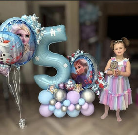 Large number 5 balloon display with themed balloon styling