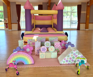 Pastel-themed soft play package with matching inflatable castle