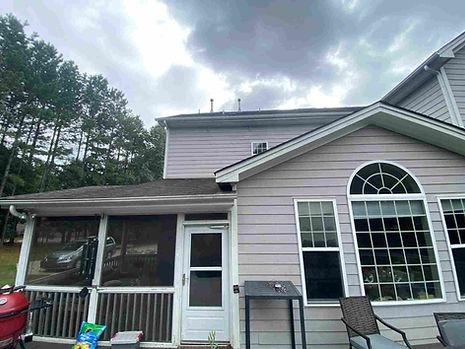 Residential exterior house painting in Chapel Hill NC with porch repainted white and new screens installed in Briar Chapel 27516.