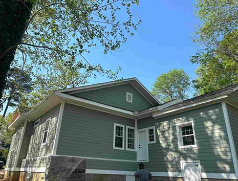 Exterior painting Carrboro NC home with green siding and white trim repaint in Bolin Forest 27510.