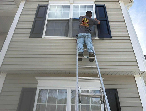 Exterior painting Wendell NC project with window shutter repainting and screen installation in Goodwin Chase 27591.