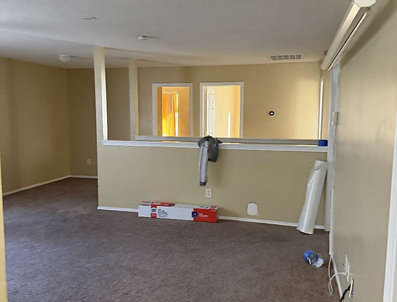 Living room before interior painting project in Pineview Zebulon NC showing walls and ceiling ready for painting.